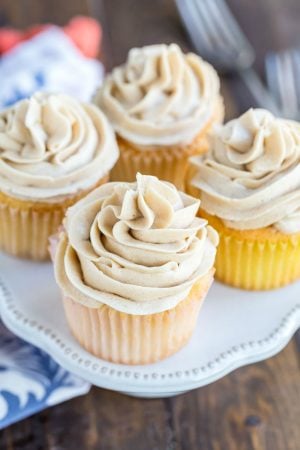 Whipped brown sugar buttercream frosting on a vanilla cupcake