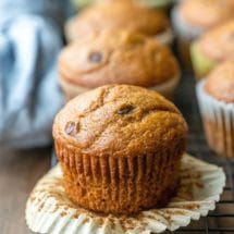 Pumpkin chocolate chip muffin with the muffin liner peeled down
