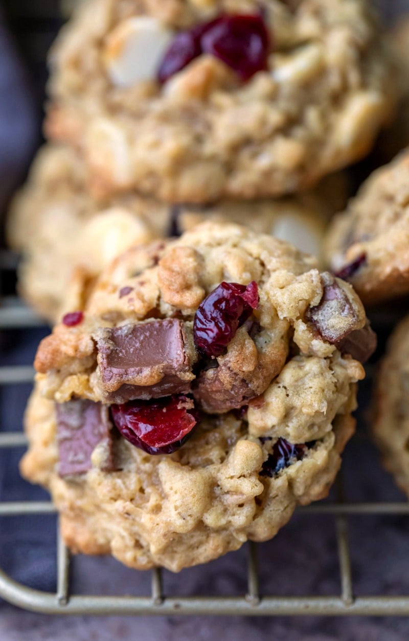Cranberry oatmeal cookie on a gold wire cooling rack