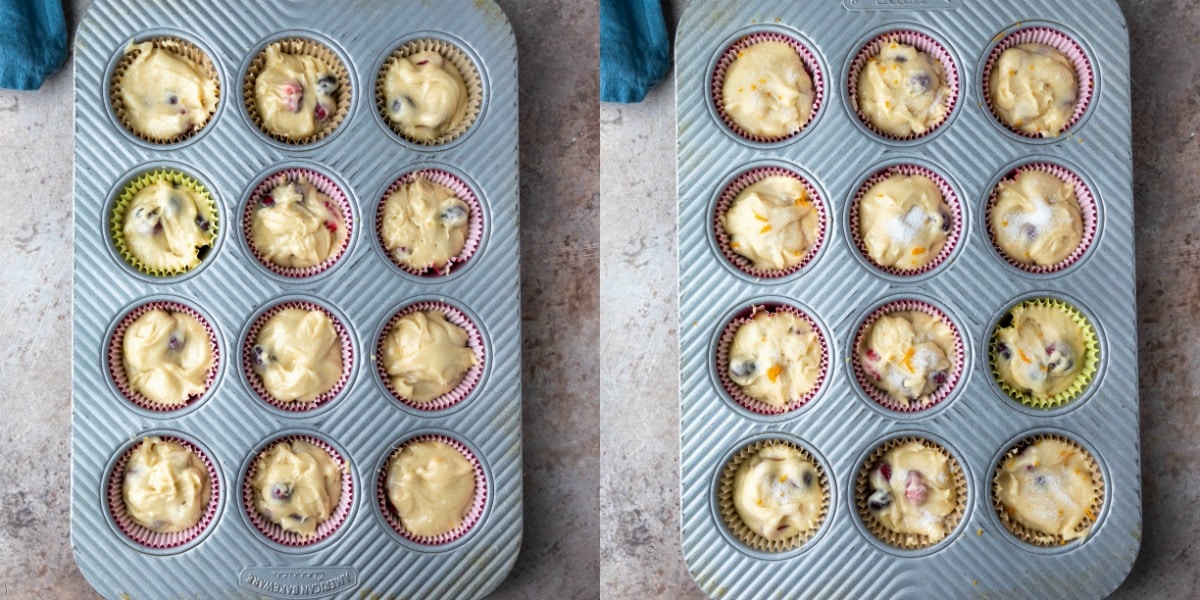 Unbaked cranberry orange muffin batter in a silver muffin tin