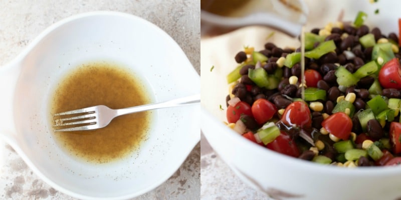 Homemade dressing pouring onto black bean salad