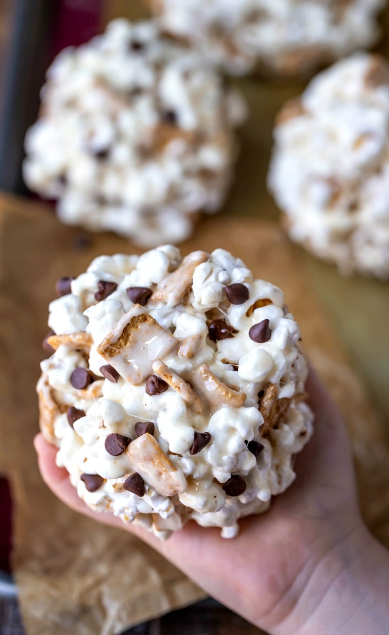 Child's hand holding a s'mores popcorn ball