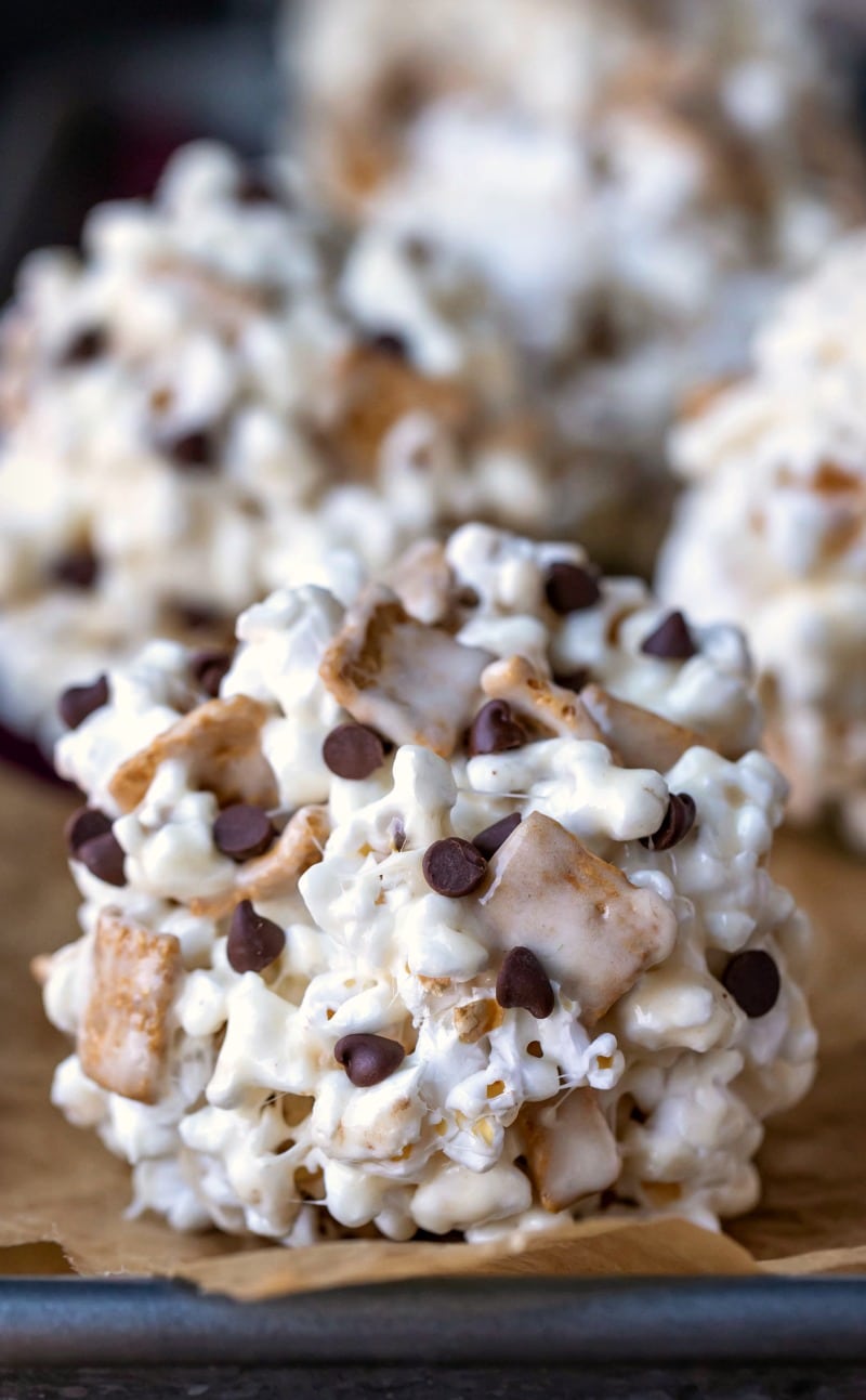 S'mores Popcorn Balls on a parchment lined baking sheet