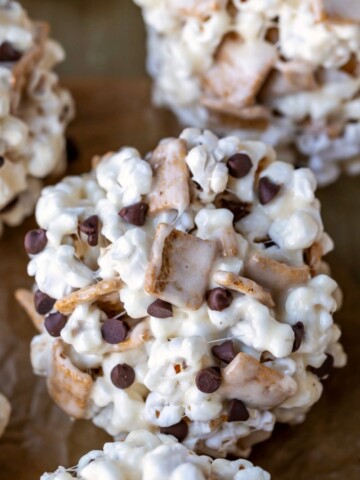 S'mores popcorn balls on a piece of brown parchment paper