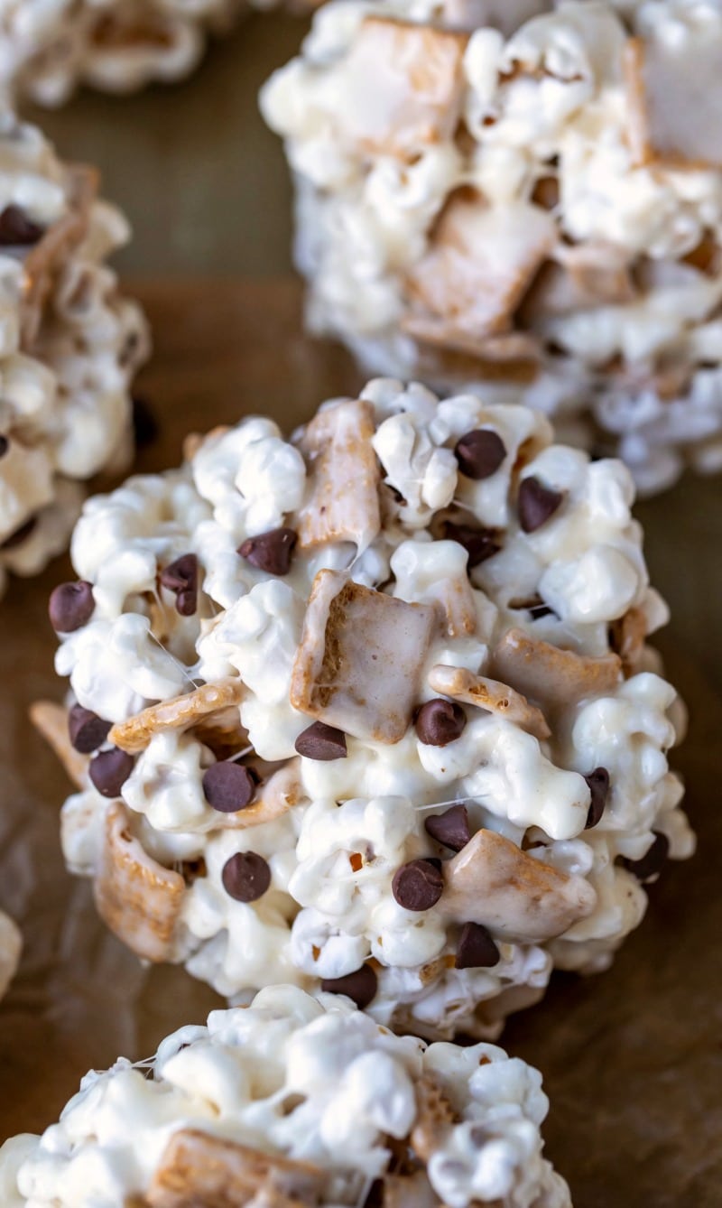 S'mores popcorn balls on a piece of brown parchment paper