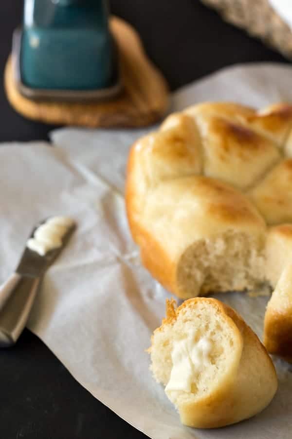 Buttered Slow Cooker Dinner Roll next to a butter knife and butter