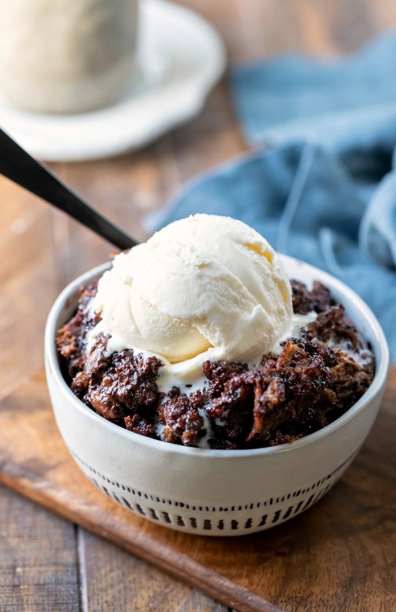 Crock pot triple chocolate bread pudding in a cream dish