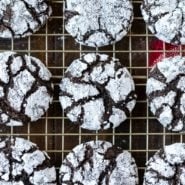 Chocolate Crinkle Cookies on a gold wire cooling rack