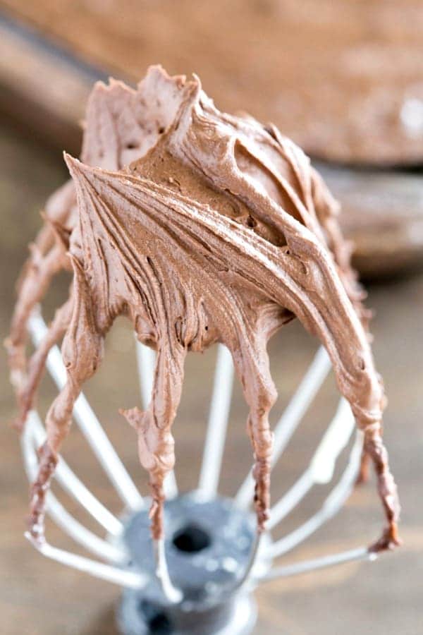Chocolate frosting on a wire beater