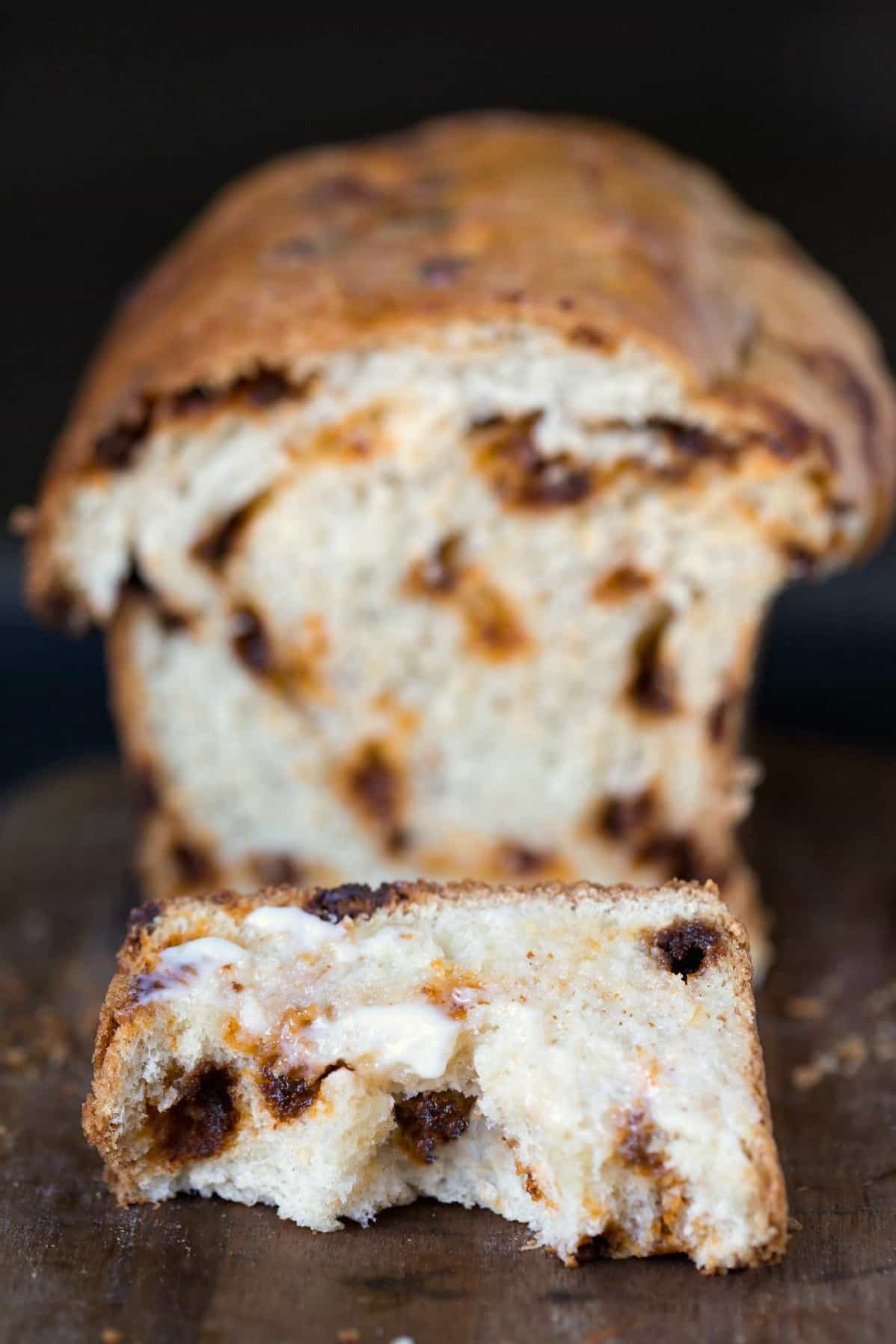 Slice of cinnamon chip bread with two bites missing