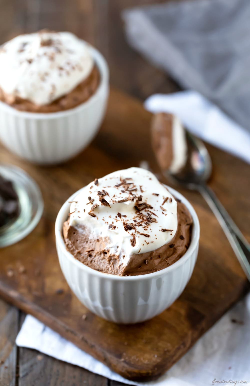 Chocolate mousse in a white dish with a bite missing