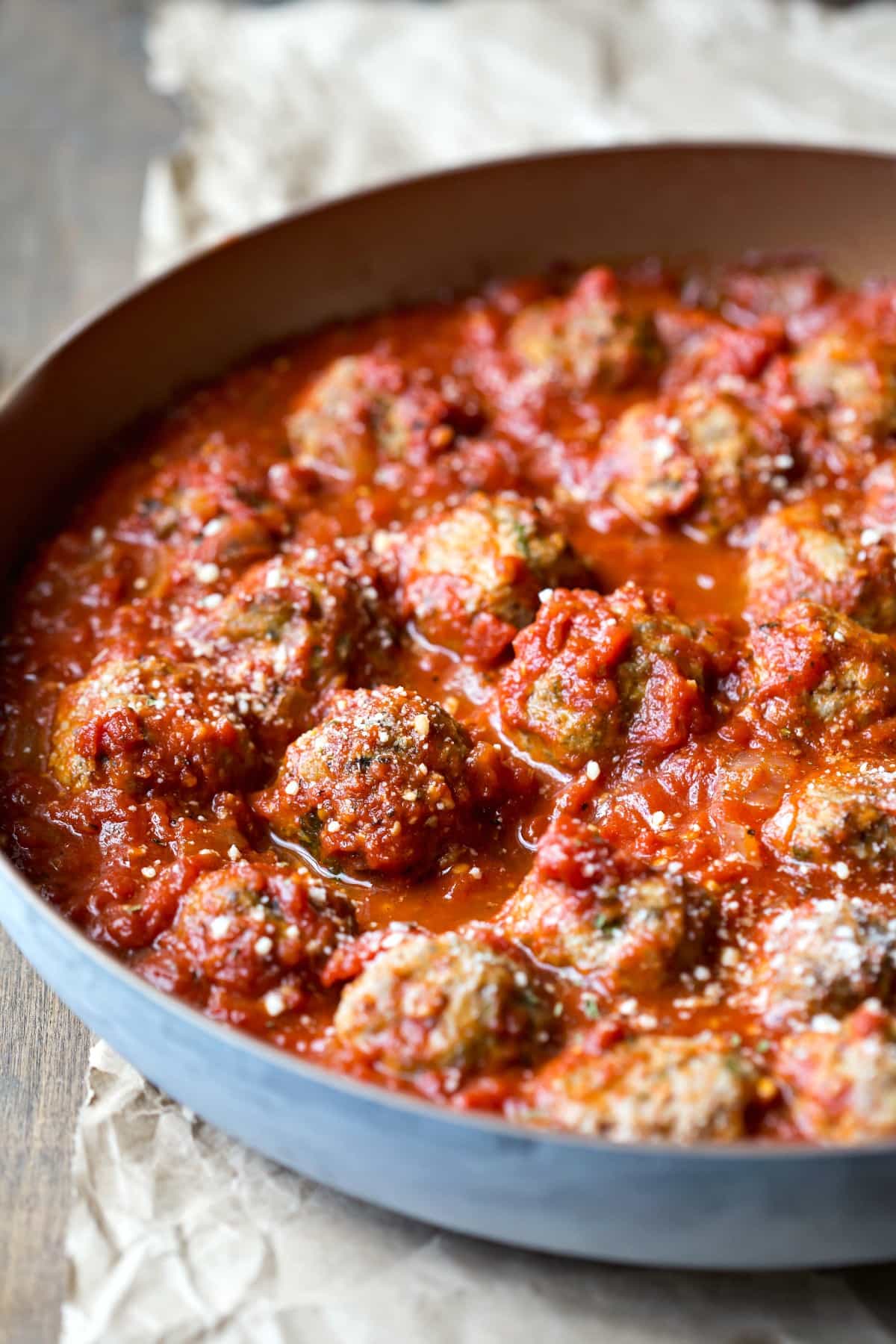 Baked Meatballs in a skillet with sauce
