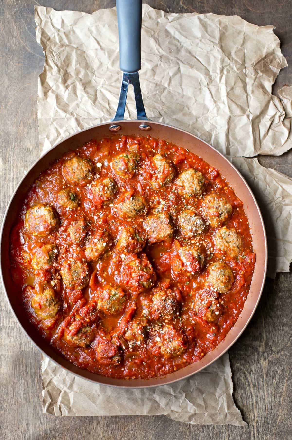 Baked Meatballs in marinara topped with parmesan cheese