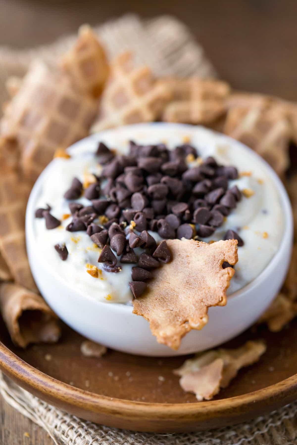 Cannoli Dip topped with chocolate chips and chopped pistachios