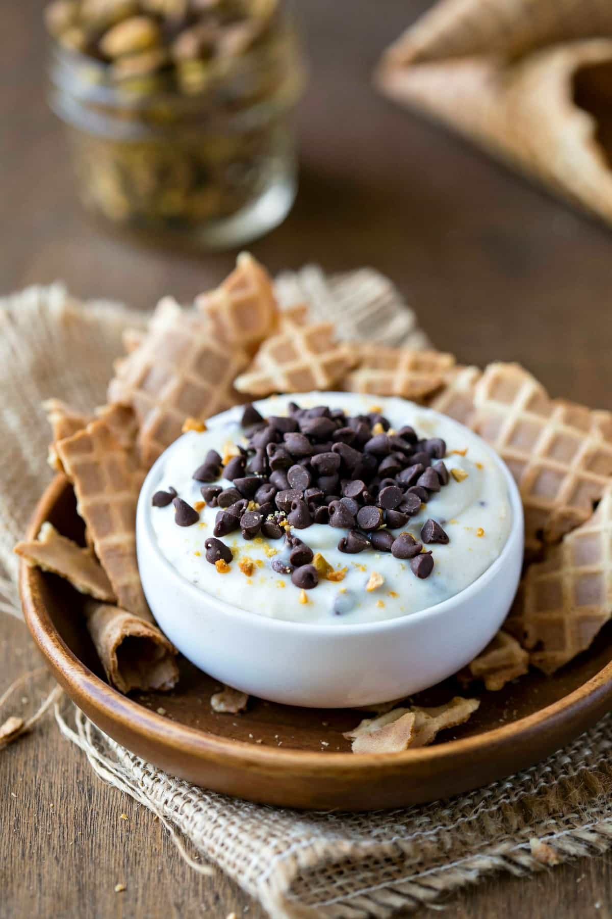 Cannoli Dip topped with chocolate chips and chopped pistachios