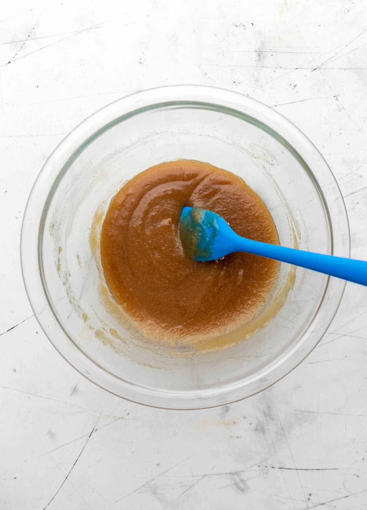 Topping mixed up in a glass mixing bowl. 