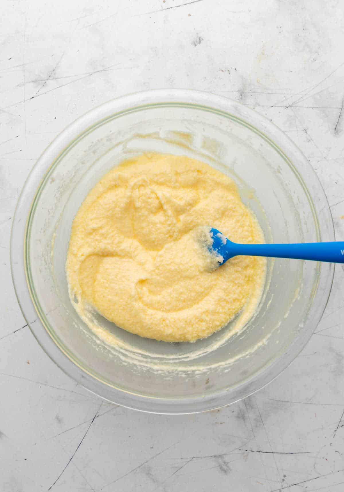 Eggs beaten into creamed butter and sugar mixture.