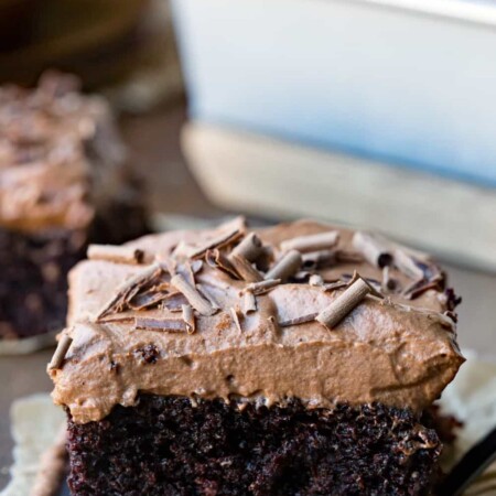 Chocolate Mousse Cake in front of a pan of cake.