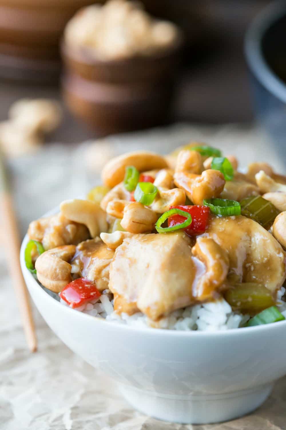 White bowl filled with rice and cashew chicken