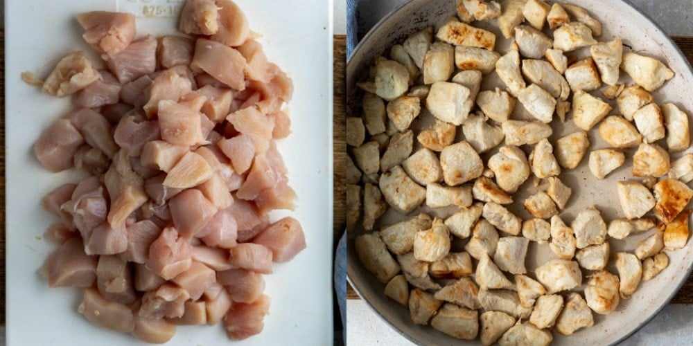 Diced uncooked chicken on a white cutting board