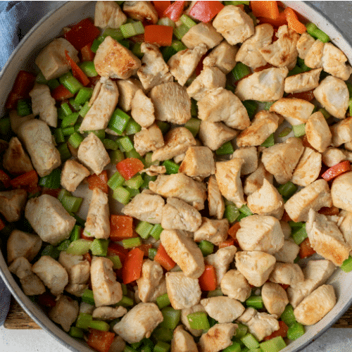 Unsauced cashew chicken in a large skillet