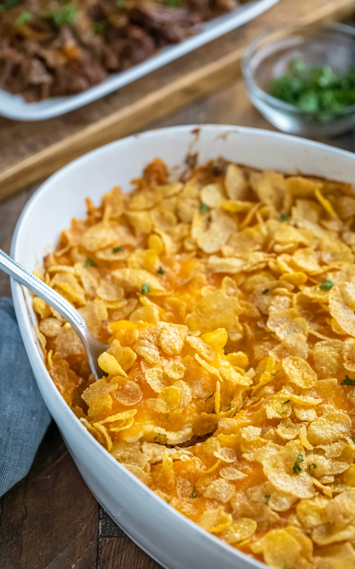 Spoon scooping out funeral potatoes