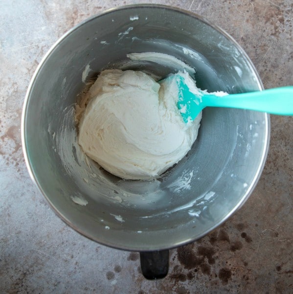 Sugar cookie frosting in a silver mixing bowl