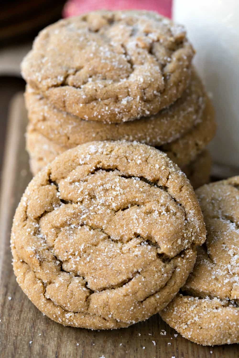Soft Ginger Molasses Cookies on a wooden cutting board. 