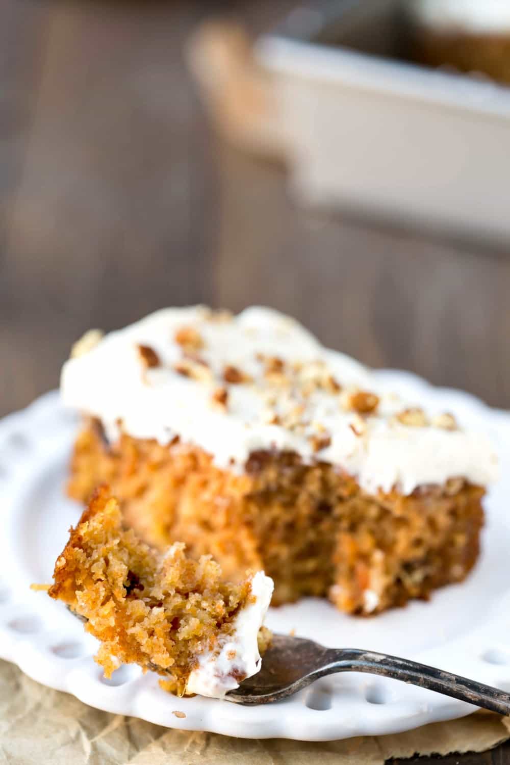 Blue Ribbon Carrot Sheet Cake Bite of Blue Ribbon Carrot Sheet Cake on a fork.