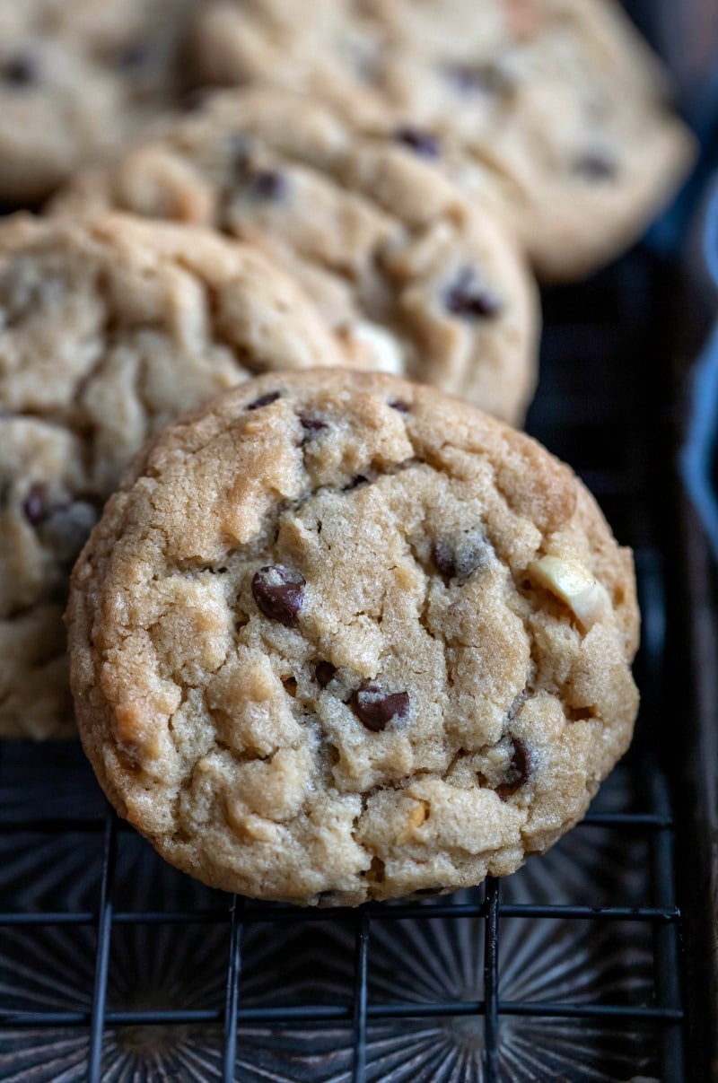 Peanut butter chocolate chip cookies on a black wire cooling rack