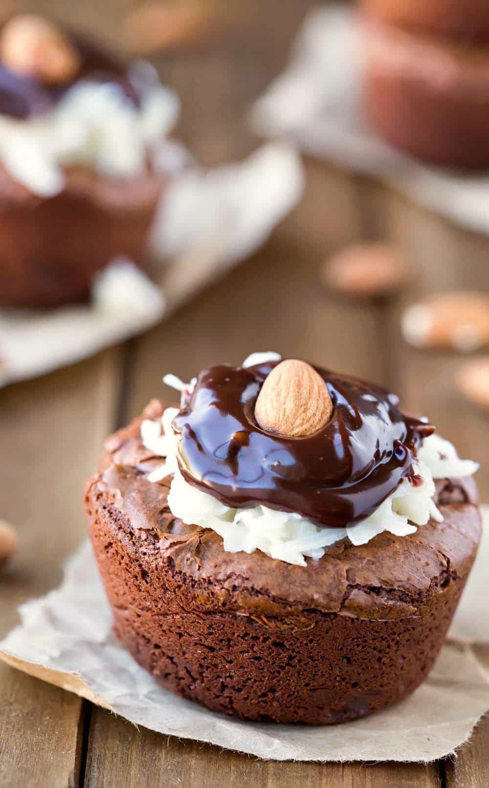 Almond Joy Brownie Bites topped with coconut and chocolate ganache
