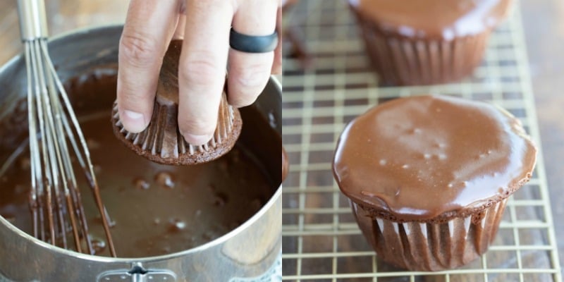 hand dipping Texas sheet cake cupcake into frosting