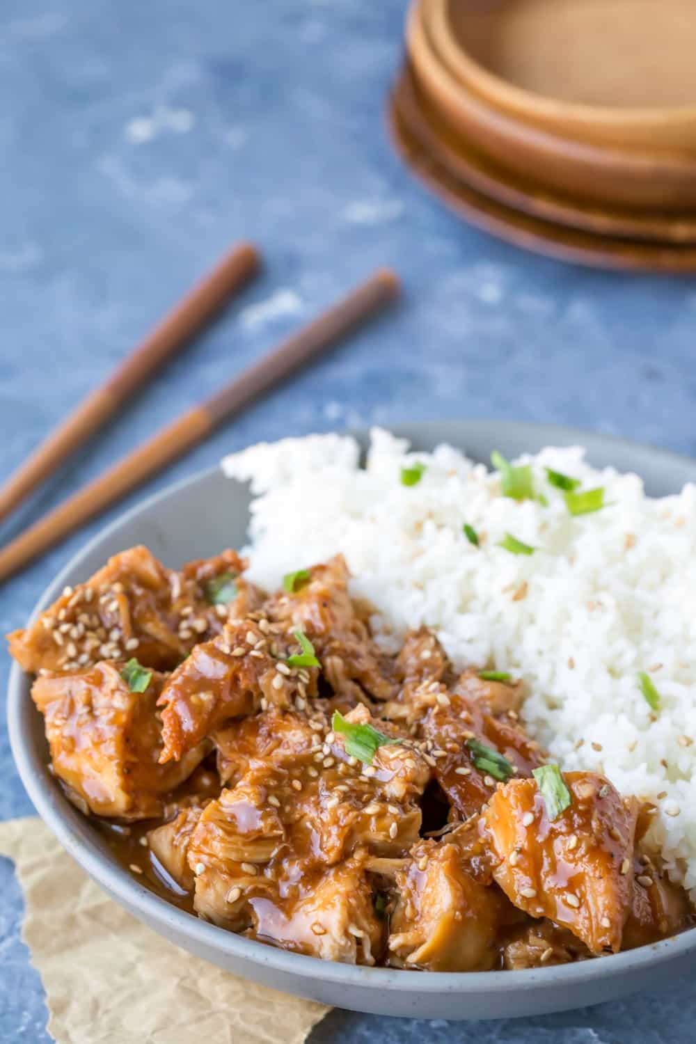 Slow Cooker Sesame Chicken and rice in a grey dish