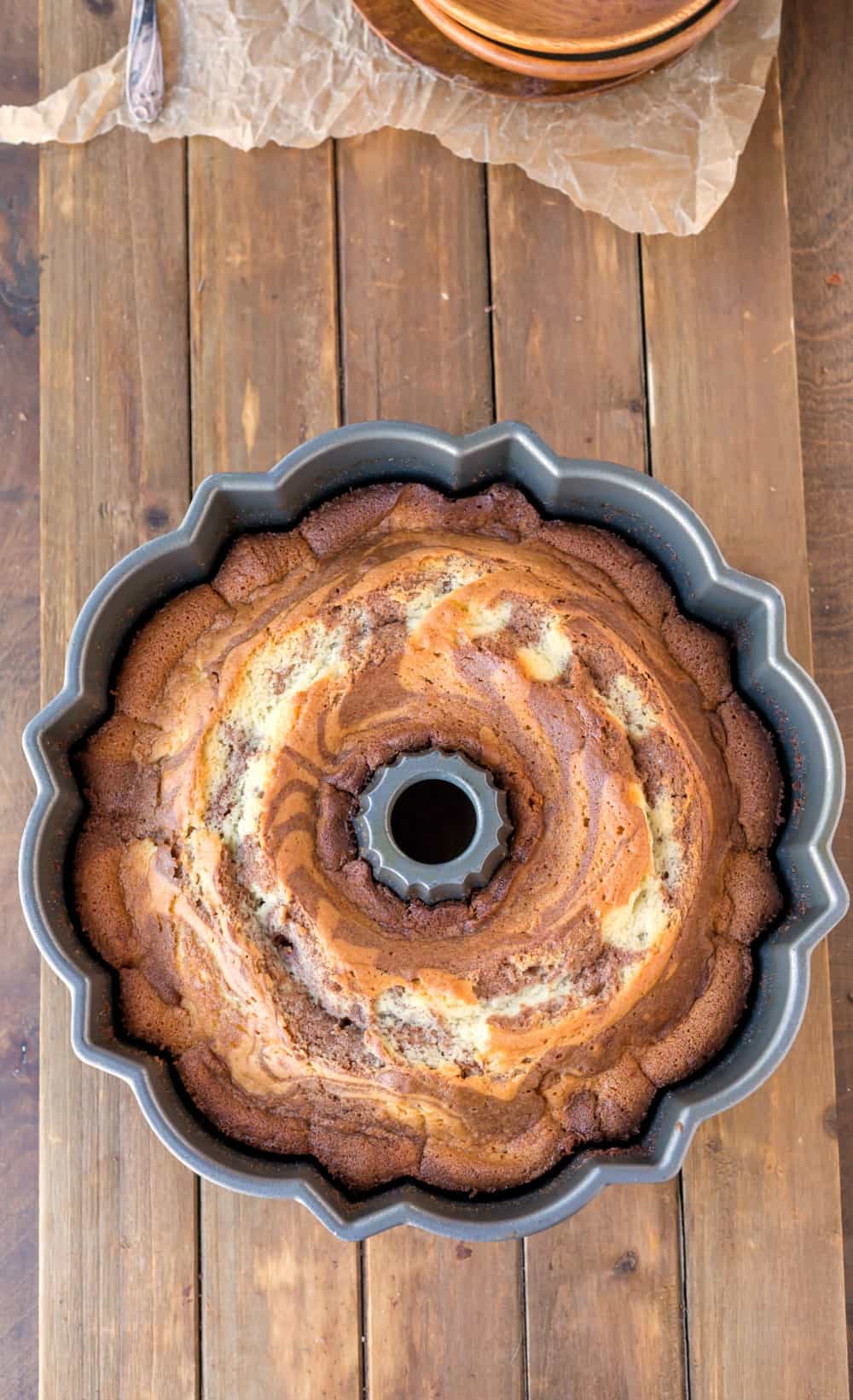 baked cinnamon swirl bundt cake in a bundt pan