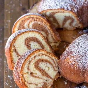 pieces of cinnamon swirl bundt cake on a wooden plate