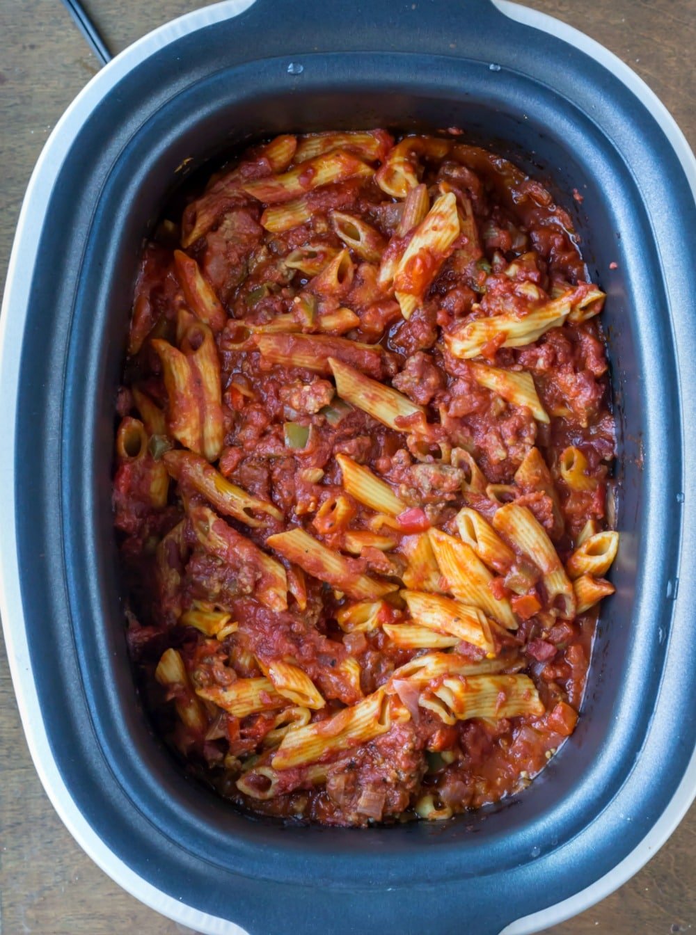 Cooked baked ziti in a slow cooker insert. 