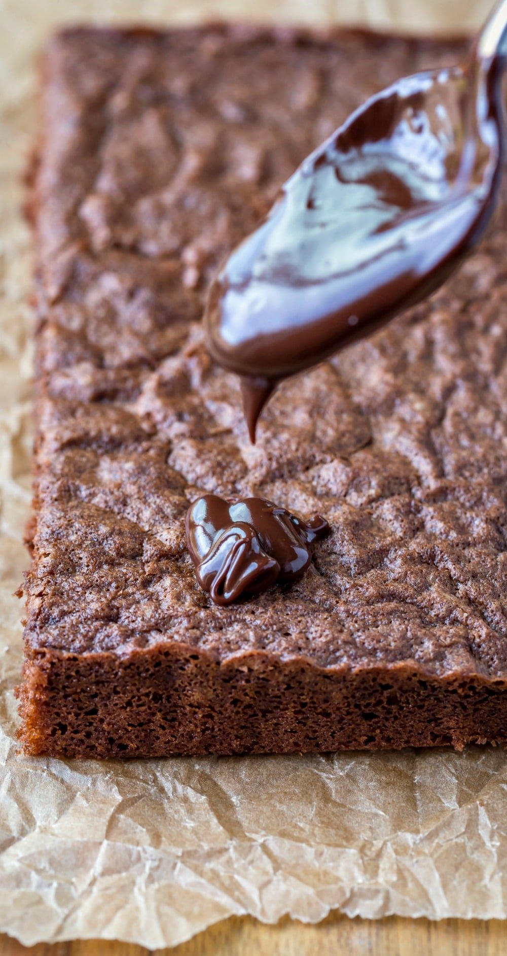 Pouring ganache onto German chocolate cake layer.