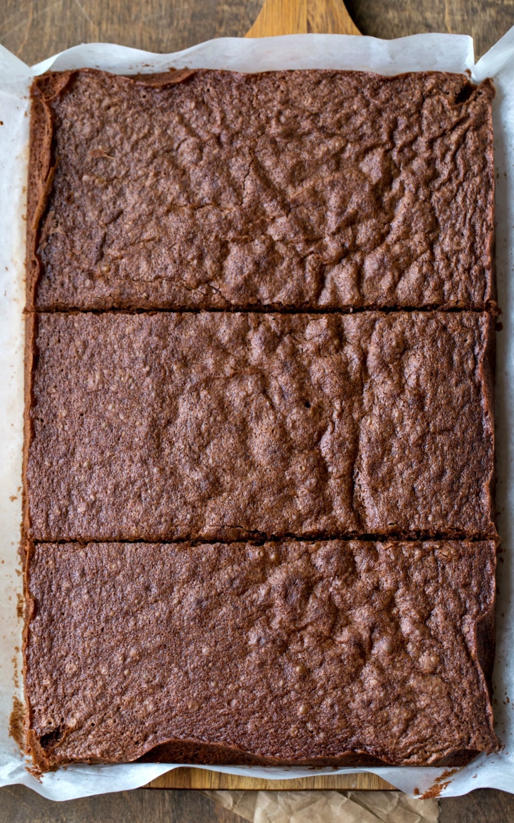 A 9 by 13 cake cut into three rectangles. 