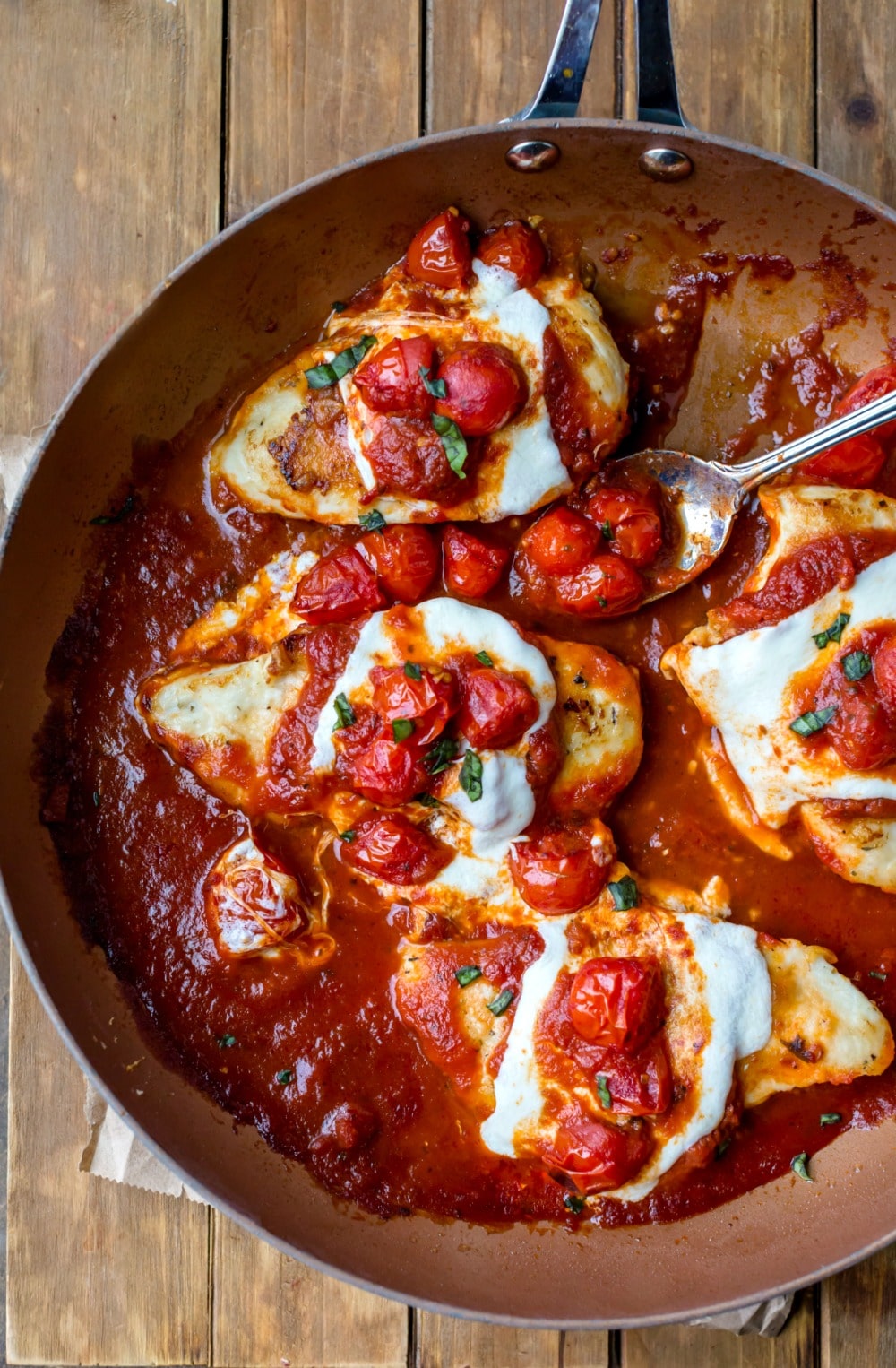 Overhead view of chicken parmesan in the skillet