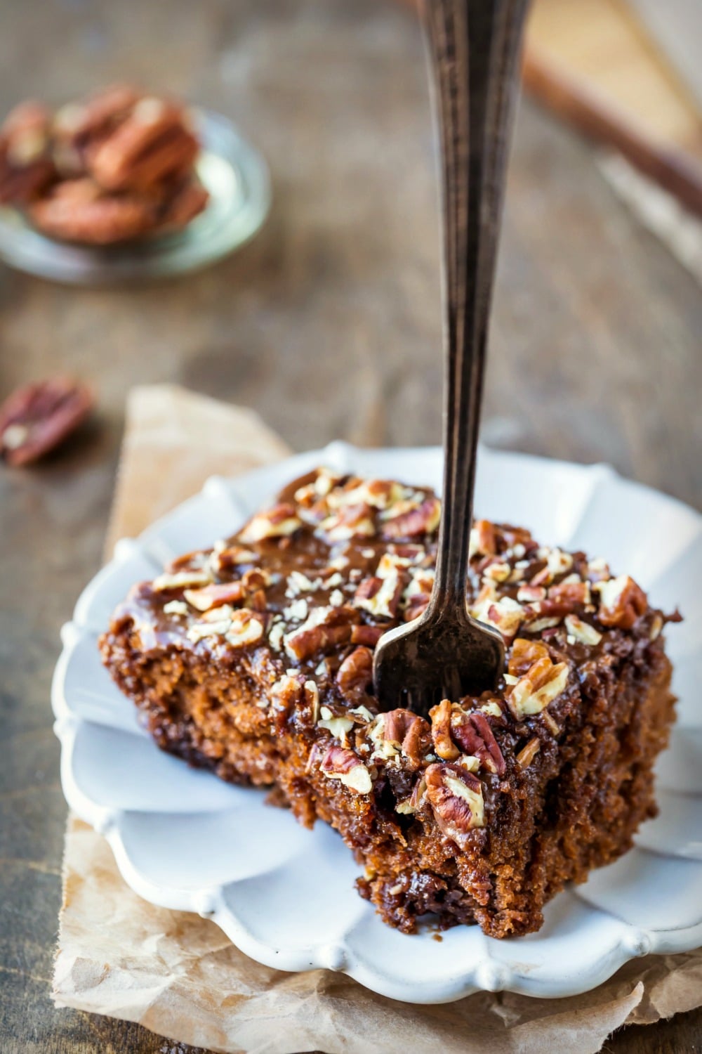 Coca Cola Cake Recipe Slice of coca cola cake with a fork taking a bite