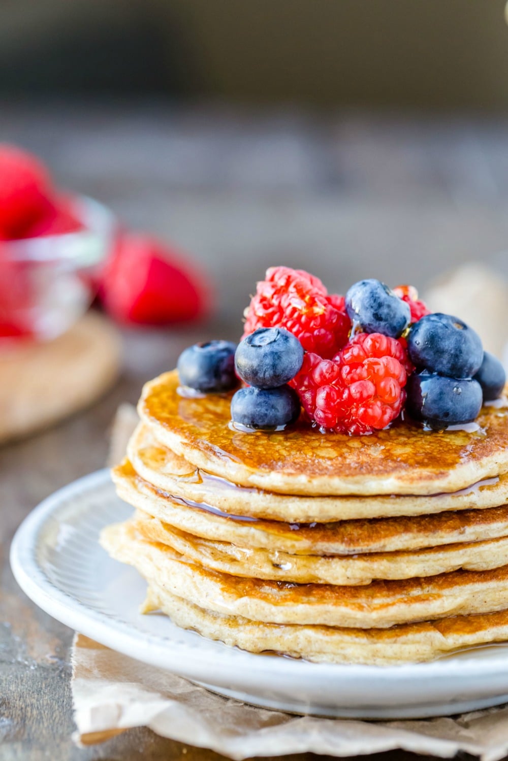 Stack of cottage cheese pancakes with berries on top