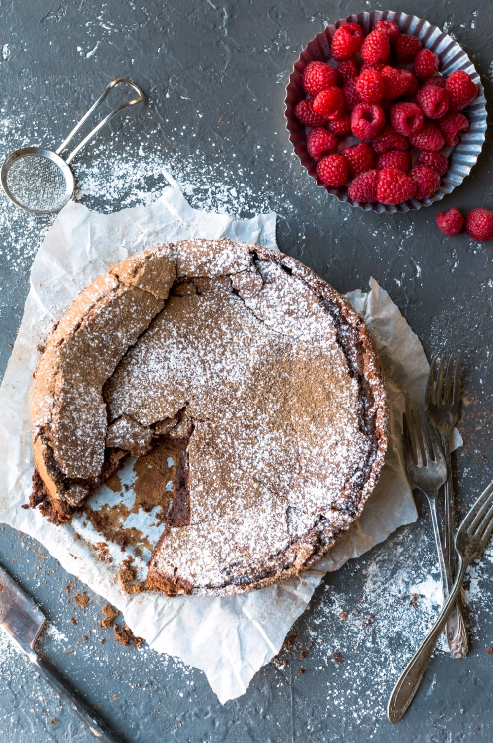 Flourless chocolate cake with a slice missing