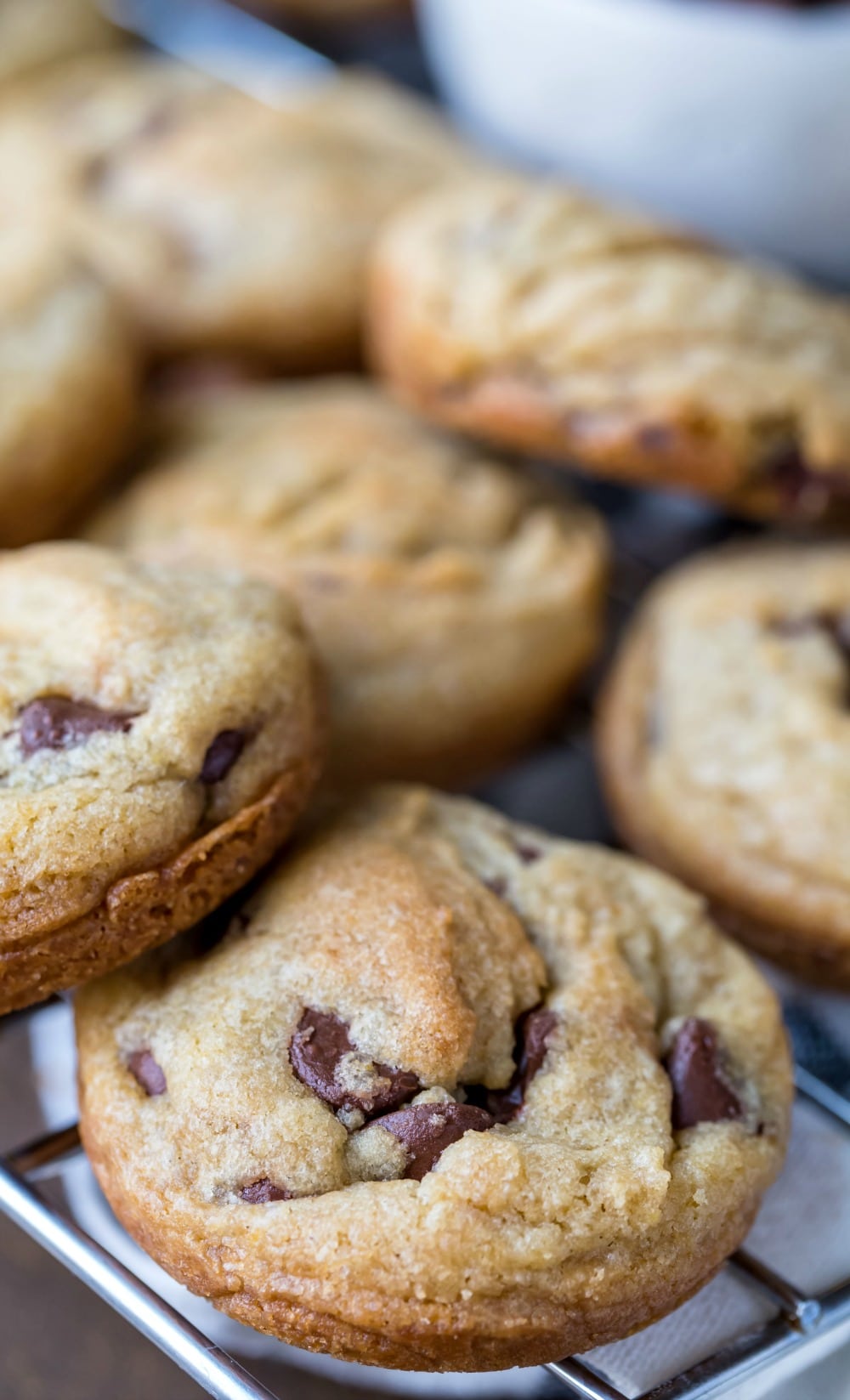 Muffin tin chocolate chip cookies on a wire cooling rack