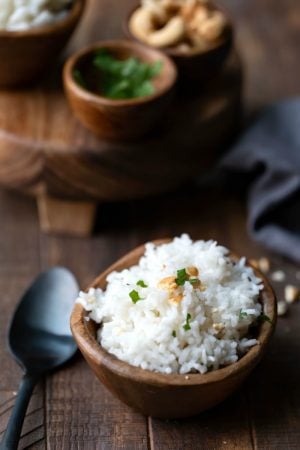 Coconut rice topped with cilantro and cashews