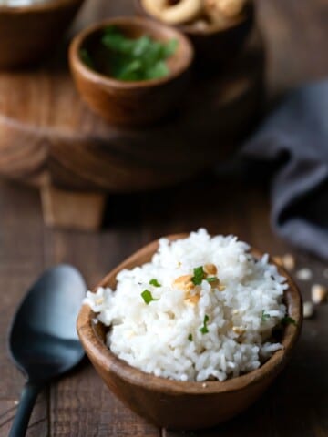 Coconut rice topped with cilantro and cashews