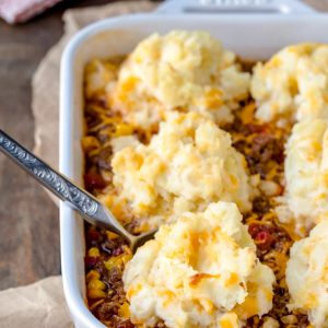 White baking dish with barbecue shepherd's pie inside of it