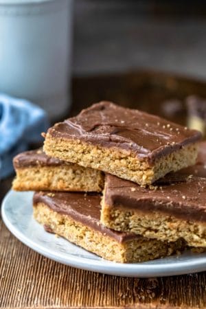 Four peanut butter bars on a white plate