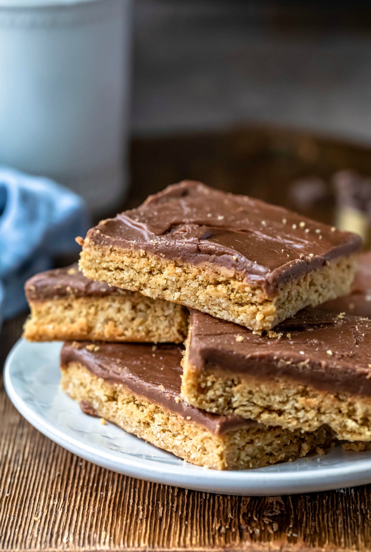 Four peanut butter bars on a white plate