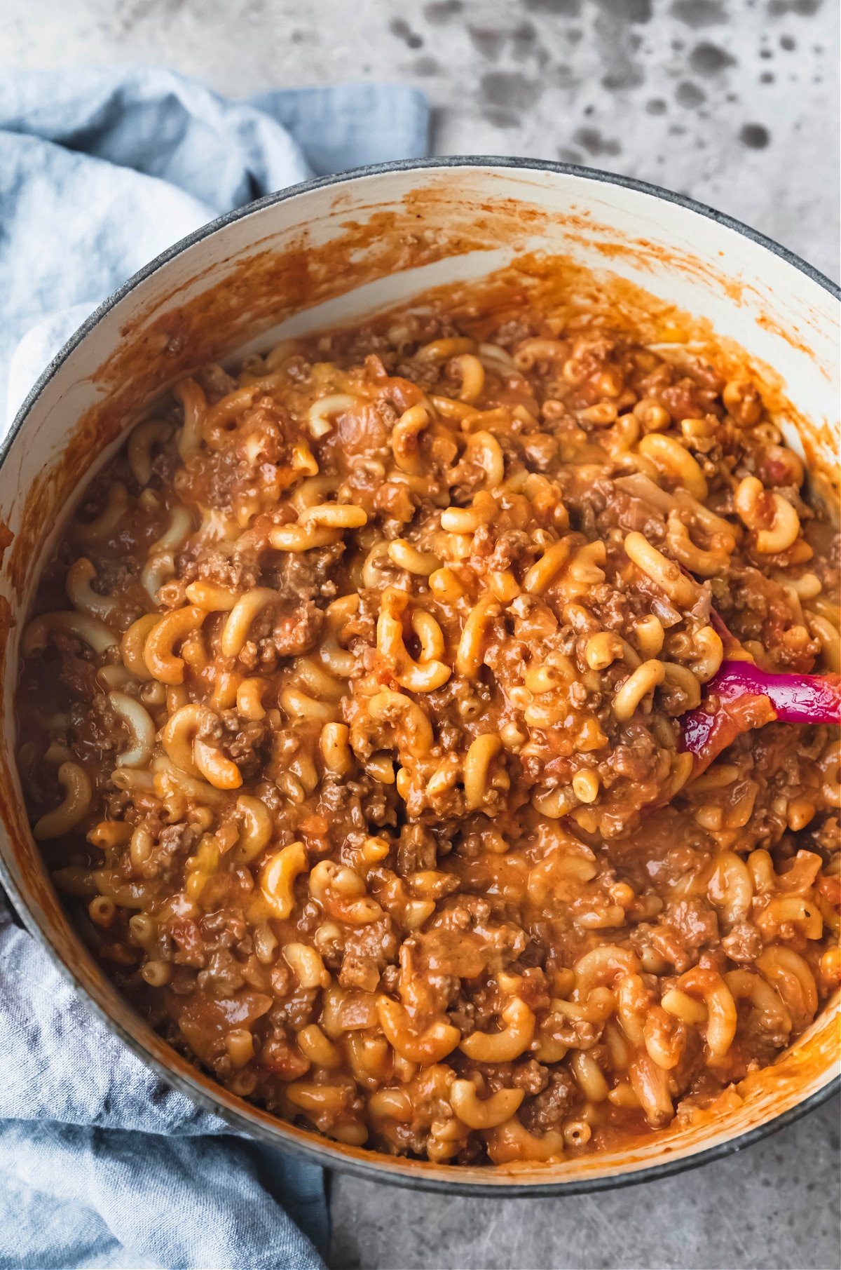 Homemade hamburger helper with a spoon scooping some out