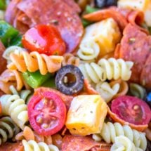 Pasta salad with pepperoni, olives, cheese, and tomatoes